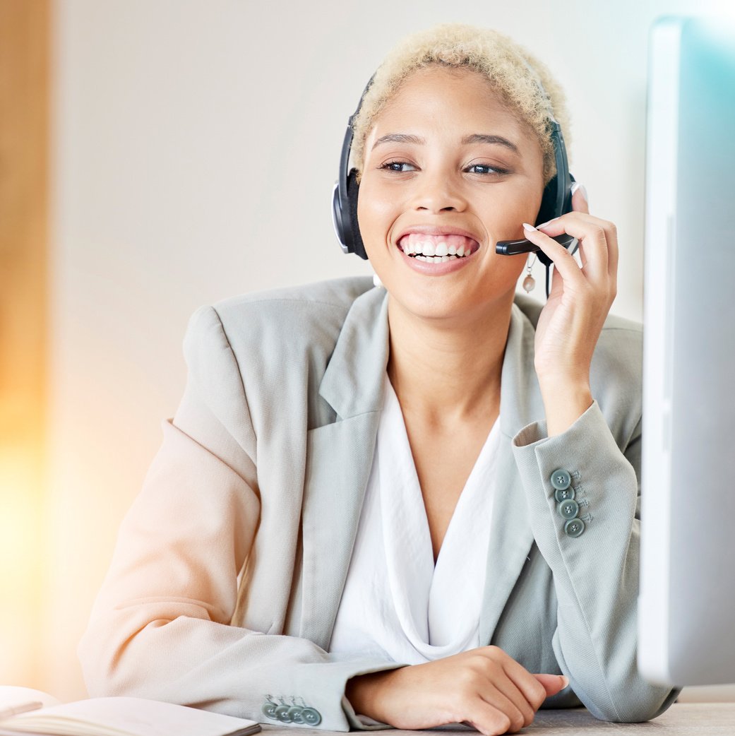 Call Center, Consulting and Help with Black Woman at Computer for Telemarketing, Customer Support and Communication. Smile, Contact Us and Crm with Employee in Office for Advice, Agent and Sales